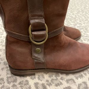 Cole Haan classic leather riding boot style with buckle detail w/Nike Air sole.